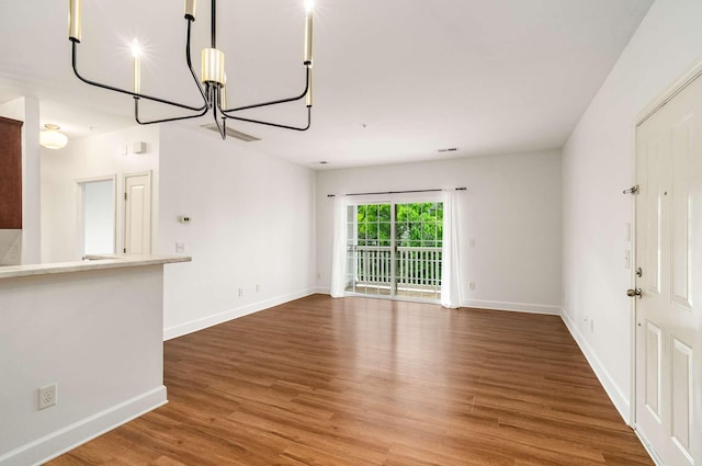8047 Bienville Dr Unit X6, Nashville, TN 37211 - unfurnished living room with a chandelier, wood finished floors, and baseboards
