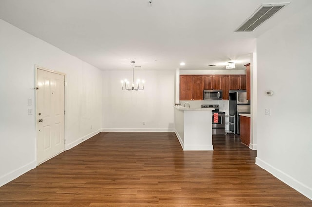 8047 Bienville Dr Unit X6, Nashville, TN 37211 - unfurnished living room featuring a chandelier, baseboards, dark wood finished floors, and recessed lighting