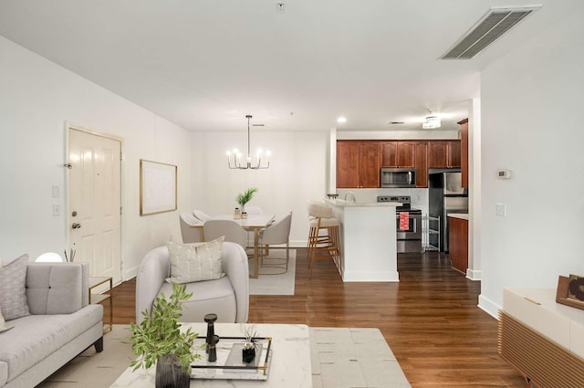 8047 Bienville Dr Unit X6, Nashville, TN 37211 - living room with a chandelier, dark wood-type flooring, recessed lighting, and baseboards