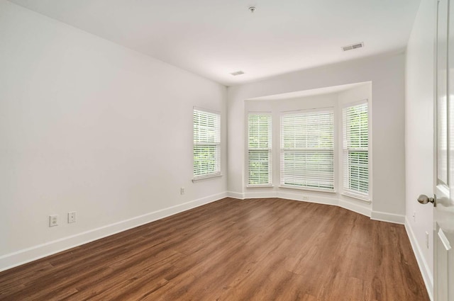 8047 Bienville Dr Unit X6, Nashville, TN 37211 - empty room with wood finished floors, baseboards, healthy amount of natural light, and fire sprinkler in ceiling