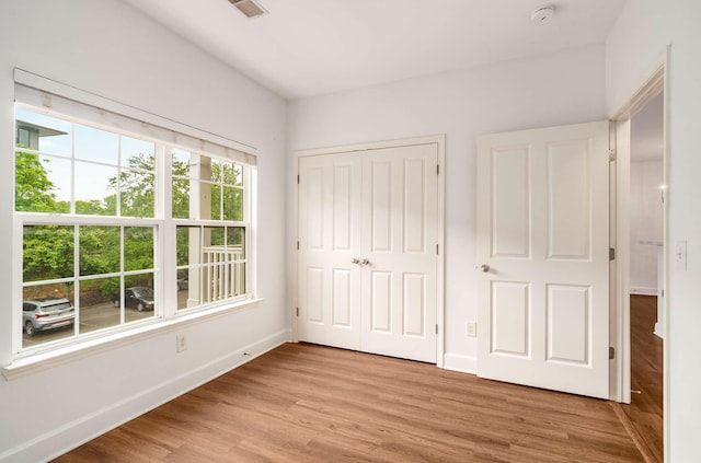 8047 Bienville Dr Unit X6, Nashville, TN 37211 - unfurnished bedroom featuring light wood-type flooring, baseboards, and a closet