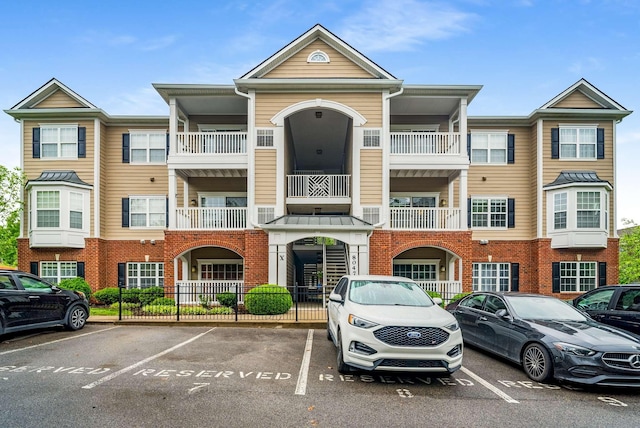 8047 Bienville Dr Unit X6, Nashville, TN 37211 - view of building exterior featuring uncovered parking