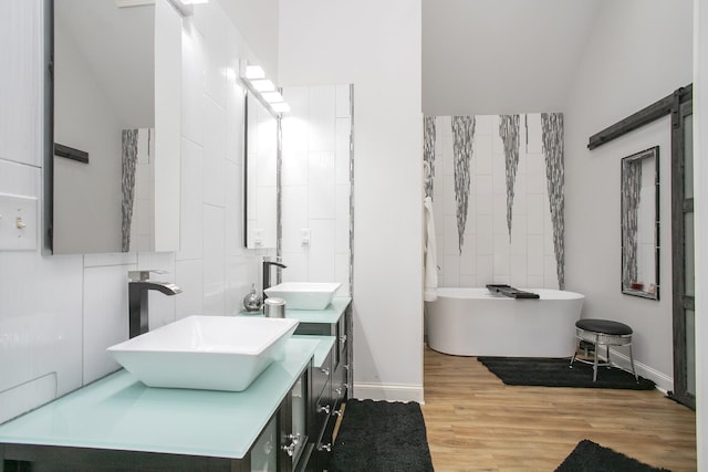 4512 General Forest Cir, Bon Aqua, TN 37025 - full bath with vaulted ceiling, a sink, and a soaking tub