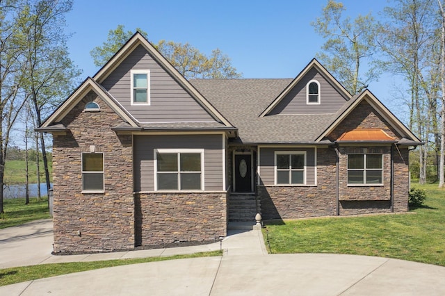 4512 General Forest Cir, Bon Aqua, TN 37025 - craftsman inspired home featuring roof with shingles, stone siding, and a front lawn