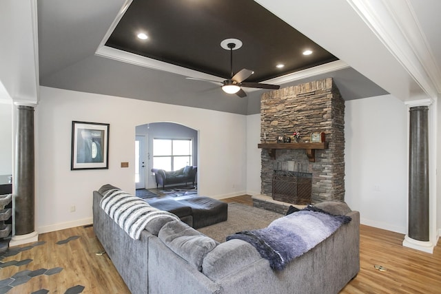 4512 General Forest Cir, Bon Aqua, TN 37025 - living room featuring ceiling fan, decorative columns, wood finished floors, and a fireplace