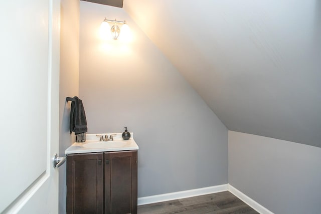 4512 General Forest Cir, Bon Aqua, TN 37025 - bathroom with vanity, baseboards, wood finished floors, and lofted ceiling