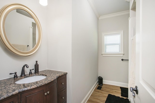 4512 General Forest Cir, Bon Aqua, TN 37025 - bathroom featuring vanity, baseboards, crown molding, and wood finished floors