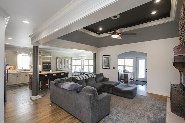 4512 General Forest Cir, Bon Aqua, TN 37025 - living area with wood finished floors, arched walkways, ornamental molding, and ceiling fan