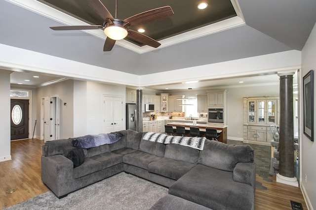 4512 General Forest Cir, Bon Aqua, TN 37025 - living area with ornamental molding, ceiling fan, decorative columns, and baseboards