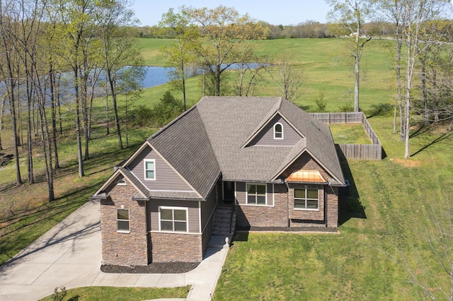4512 General Forest Cir, Bon Aqua, TN 37025 - craftsman-style house with a water view, a front lawn, stone siding, and driveway