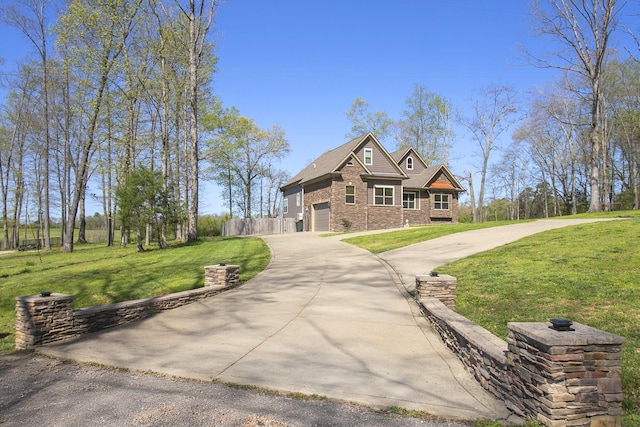 4512 General Forest Cir, Bon Aqua, TN 37025 - craftsman inspired home with a garage, fence, concrete driveway, brick siding, and a front lawn