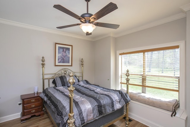 4512 General Forest Cir, Bon Aqua, TN 37025 - bedroom featuring wood finished floors, ornamental molding, and multiple windows