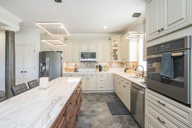 4512 General Forest Cir, Bon Aqua, TN 37025 - kitchen with a sink, appliances with stainless steel finishes, crown molding, and cream cabinets