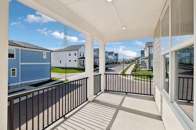 balcony featuring a residential view
