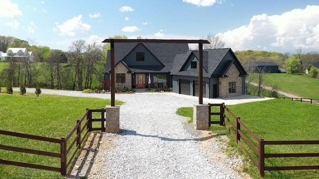 craftsman inspired home featuring a garage, fence, gravel driveway, and a front lawn