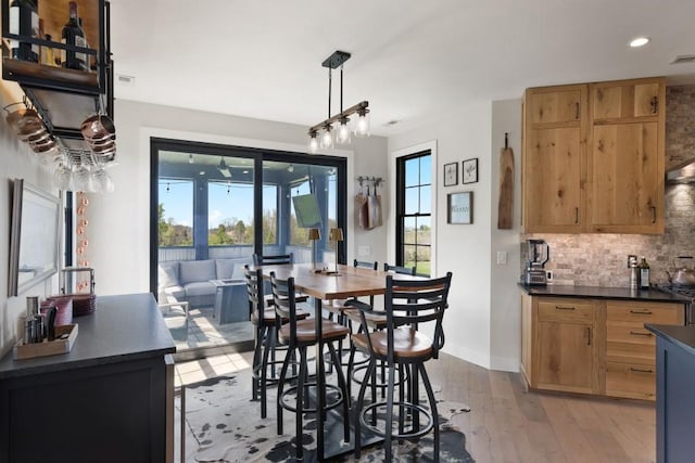 dining room with recessed lighting, light wood-style flooring, baseboards, and visible vents