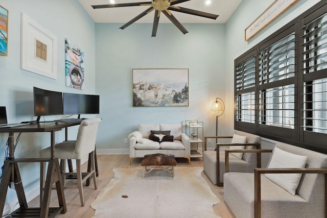 sitting room featuring baseboards, a high ceiling, ceiling fan, recessed lighting, and wood finished floors