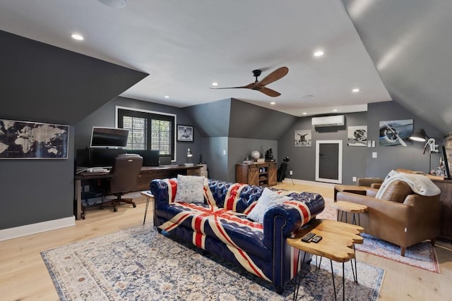 interior space featuring light wood-type flooring, a ceiling fan, a wall mounted AC, and lofted ceiling