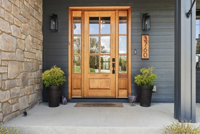 doorway to property featuring a porch