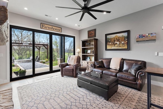 living area featuring visible vents, baseboards, a ceiling fan, recessed lighting, and tile patterned flooring