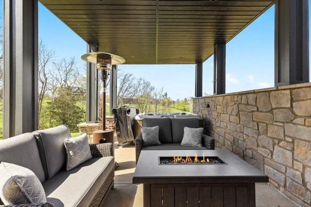 view of patio / terrace featuring an outdoor living space with a fire pit