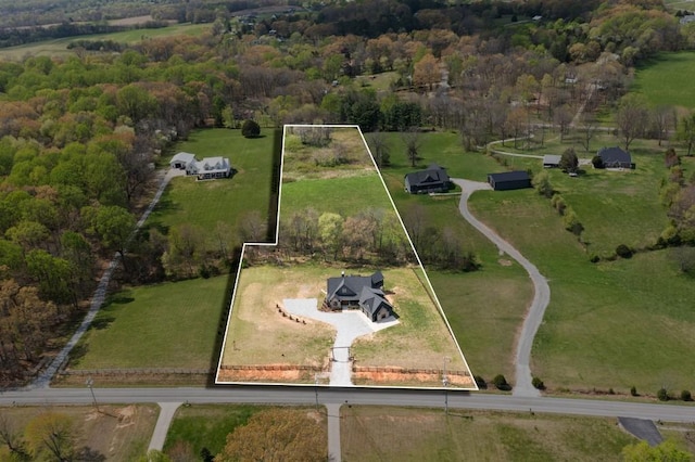birds eye view of property featuring a rural view