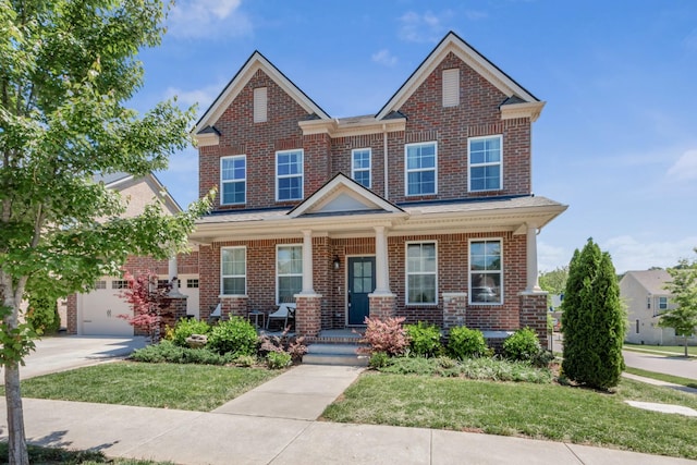 779 Newcomb St, Franklin, TN 37064 - view of front of home featuring a porch, brick siding, a front yard, driveway, and a garage