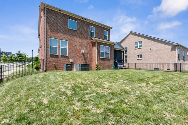 779 Newcomb St, Franklin, TN 37064 - back of house featuring brick siding, central air condition unit, and a sunroom
