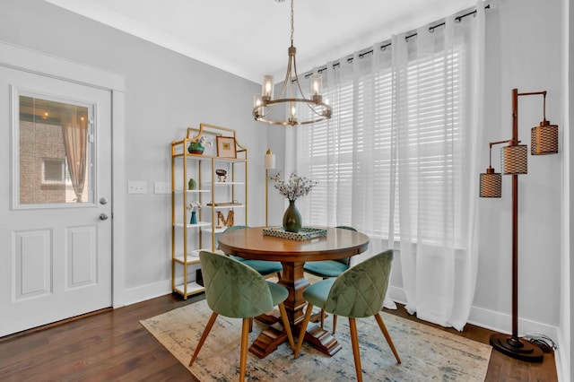 779 Newcomb St, Franklin, TN 37064 - dining room with a chandelier, dark wood finished floors, and baseboards