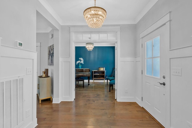 779 Newcomb St, Franklin, TN 37064 - entrance foyer featuring a chandelier, hardwood / wood-style floors, ornamental molding, a decorative wall, and wainscoting