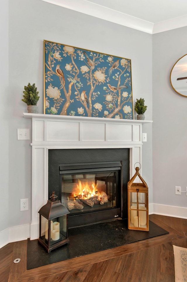 779 Newcomb St, Franklin, TN 37064 - detailed view of a glass covered fireplace, baseboards, crown molding, and wood finished floors