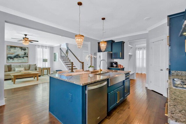 779 Newcomb St, Franklin, TN 37064 - kitchen featuring appliances with stainless steel finishes, blue cabinets, a sink, dark wood finished floors, and crown molding