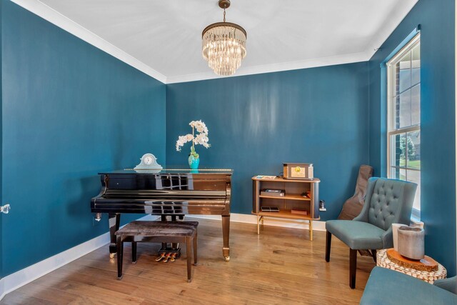 779 Newcomb St, Franklin, TN 37064 - sitting room featuring a chandelier, baseboards, wood finished floors, and crown molding