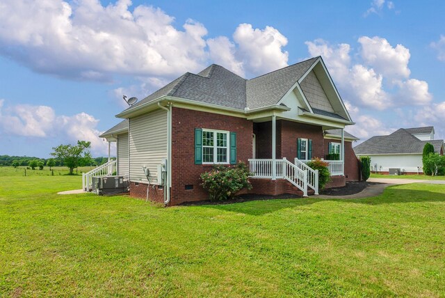 1967 Overland Dr, Chapel Hill, TN 37034 - view of front of house with central AC, a front lawn, a shingled roof, crawl space, and brick siding