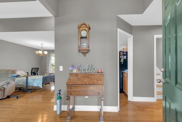 1967 Overland Dr, Chapel Hill, TN 37034 - foyer entrance featuring light wood finished floors, baseboards, and a chandelier