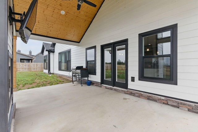 view of patio / terrace featuring fence, a ceiling fan, and grilling area