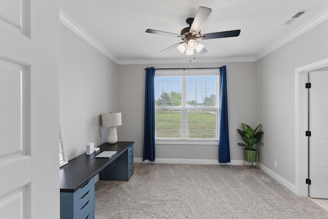 office area featuring a ceiling fan, baseboards, crown molding, and light carpet