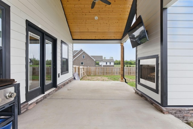 view of patio / terrace with fence and ceiling fan