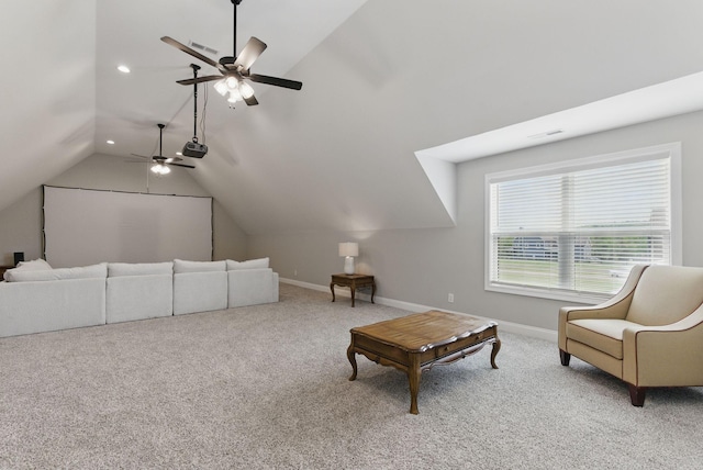living area featuring ceiling fan, carpet flooring, vaulted ceiling, and baseboards