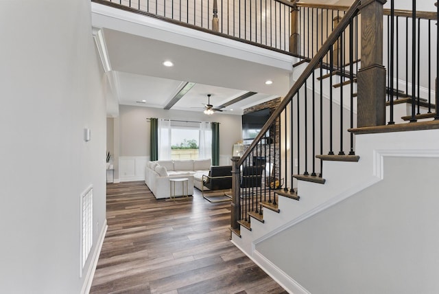 stairway featuring beamed ceiling, visible vents, recessed lighting, wood finished floors, and a ceiling fan