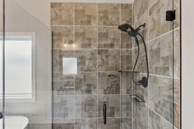 full bath featuring a shower stall and plenty of natural light