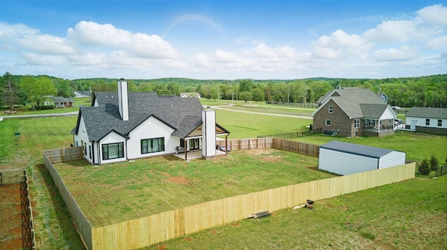 drone / aerial view featuring a view of trees