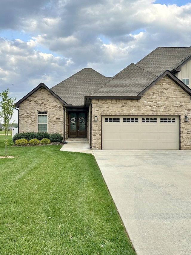 1049 Veridian Dr Unit A, Clarksville, TN 37043 - french provincial home with brick siding, an attached garage, roof with shingles, and concrete driveway