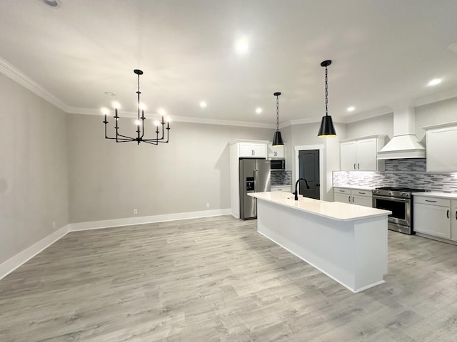1049 Veridian Dr Unit A, Clarksville, TN 37043 - kitchen with appliances with stainless steel finishes, premium range hood, a kitchen island with sink, recessed lighting, and backsplash