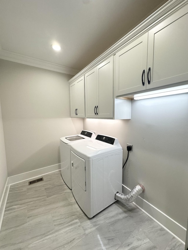 1049 Veridian Dr Unit A, Clarksville, TN 37043 - washroom with cabinet space, crown molding, washing machine and dryer, baseboards, and light marble finish floors