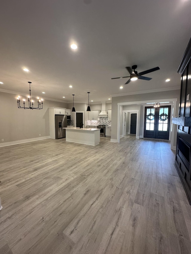 1049 Veridian Dr Unit A, Clarksville, TN 37043 - unfurnished living room featuring crown molding, a chandelier, recessed lighting, baseboards, and ceiling fan