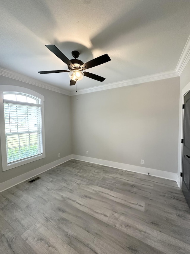 1049 Veridian Dr Unit A, Clarksville, TN 37043 - empty room featuring ornamental molding, wood finished floors, baseboards, and a ceiling fan