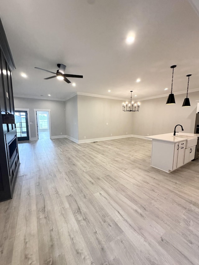 1049 Veridian Dr Unit A, Clarksville, TN 37043 - unfurnished living room with crown molding, ceiling fan, light wood-type flooring, baseboards, and recessed lighting