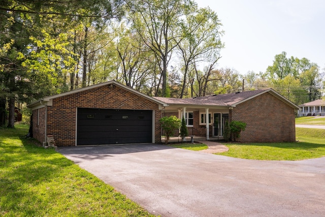 1203 W White Oak Dr, Cookeville, TN 38501 - ranch-style house featuring an attached garage, driveway, a front yard, and brick siding