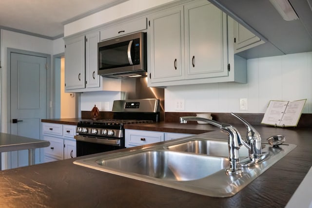 1203 W White Oak Dr, Cookeville, TN 38501 - kitchen featuring a sink, ornamental molding, and stainless steel appliances